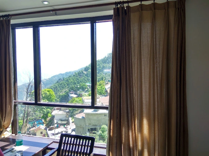 A scenic view from the balcony of Hotel Dwaper, overlooking the picturesque landscape of Mussoorie.