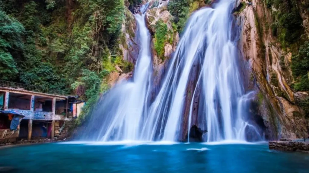 Kempty Falls, a cascading waterfall surrounded by lush greenery in Mussoorie